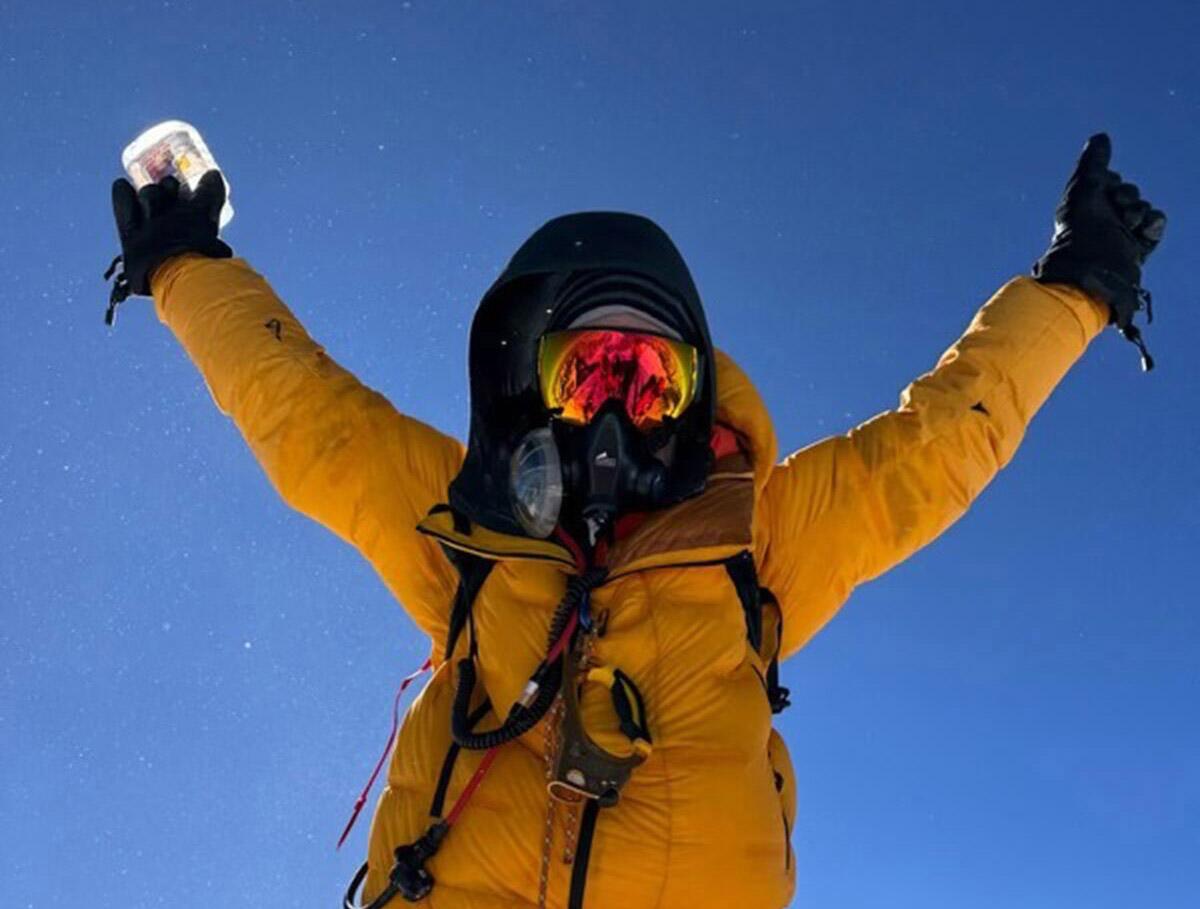 Graham Cooper reaches the summit of Mt. Everest.