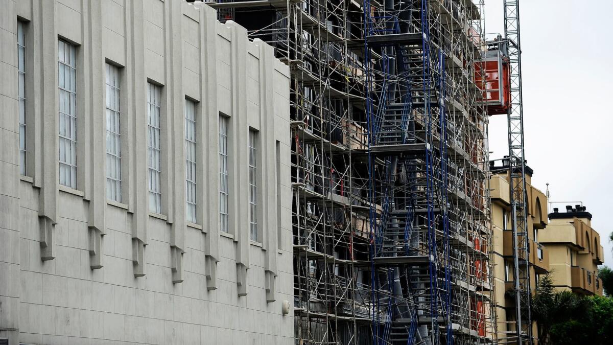 New residential construction rises next to the iconic Wilshire Tower on the Miracle Mile.