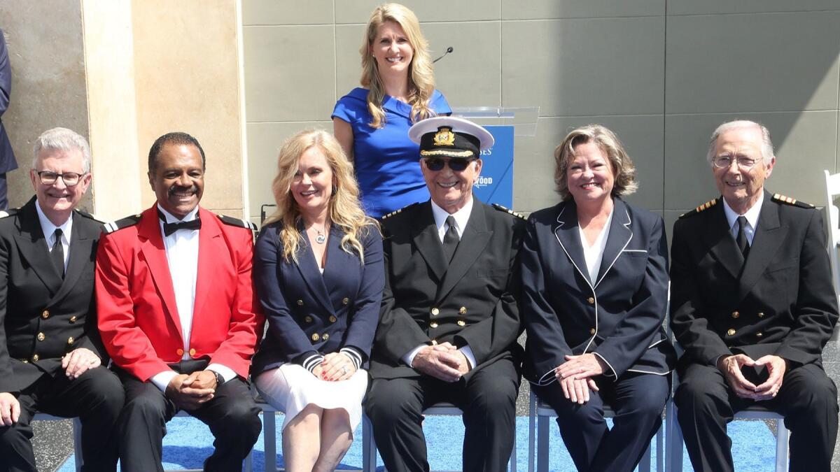 Jan Swartz, Princess Cruises president, behind the "Love Boat" cast: From left, Fred Grandy, Ted Lange, Jill Whelan, Gavin MacLeod, Lauren Tewes and Bernie Kopell. The series received an honorary plaque on the Hollywood Walk of Fame.