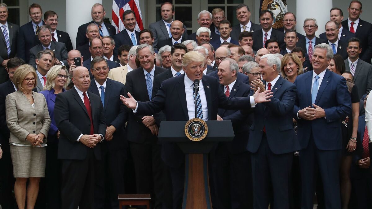 House Majority Leader Kevin McCarthy, front right, at the White House in May 2017 as President Trump speaks on legislation aimed at repealing Obamacare.