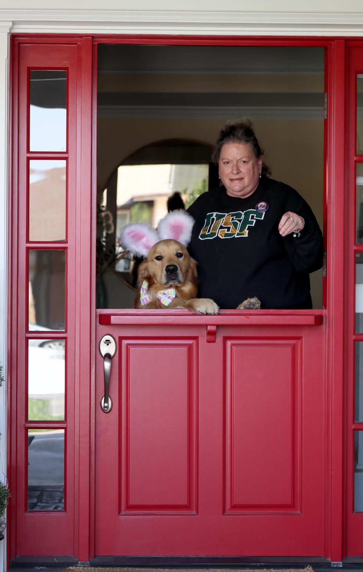 Fletcher, a two-year old golden retriever wearing bunny ears and a bow tie, is pictured with owner Ellen Kuhnert.