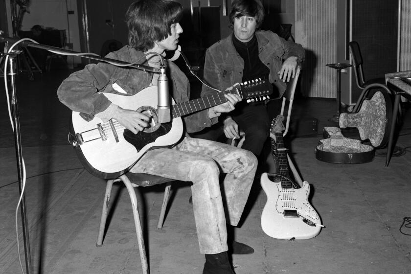 George Harrison plays John Lennon's Framus 12-string Hootenanny acoustic guitar.