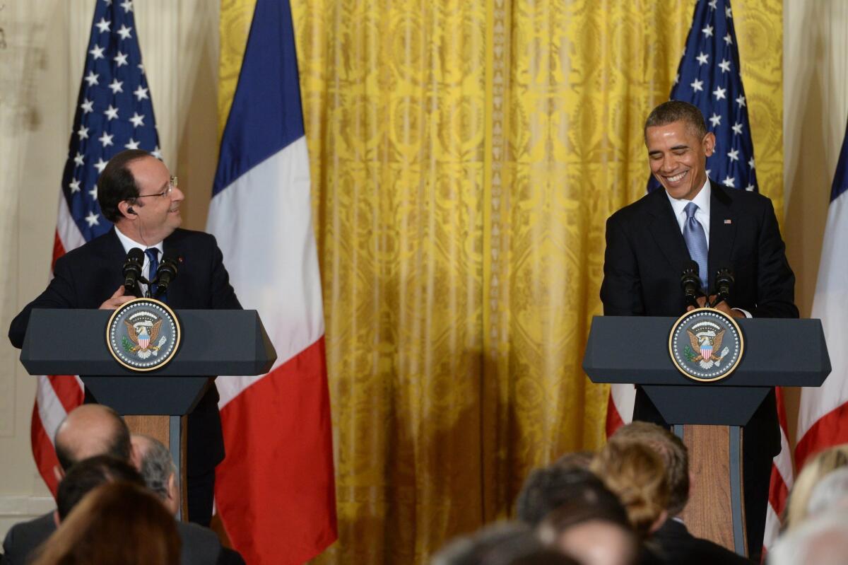 President Obama joins French President Francois Hollande at a news conference in the East Room of the White House.