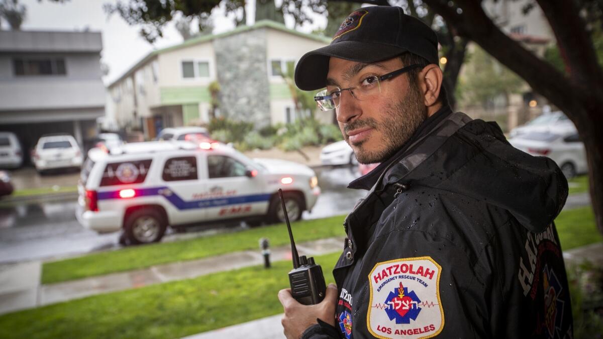 Aharon Sabbagh, an emergency medical technician with Hatzolah, a Jewish volunteer EMT service that primarily services the Jewish community of Pico-Robertson, waits for a medical call last month in the Beverly Hills area.