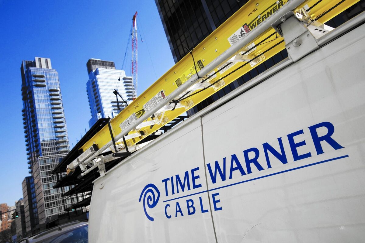 A Time Warner Cable truck in New York. Charter Communications has completed its purchase of the provider and plans to phase out the name.