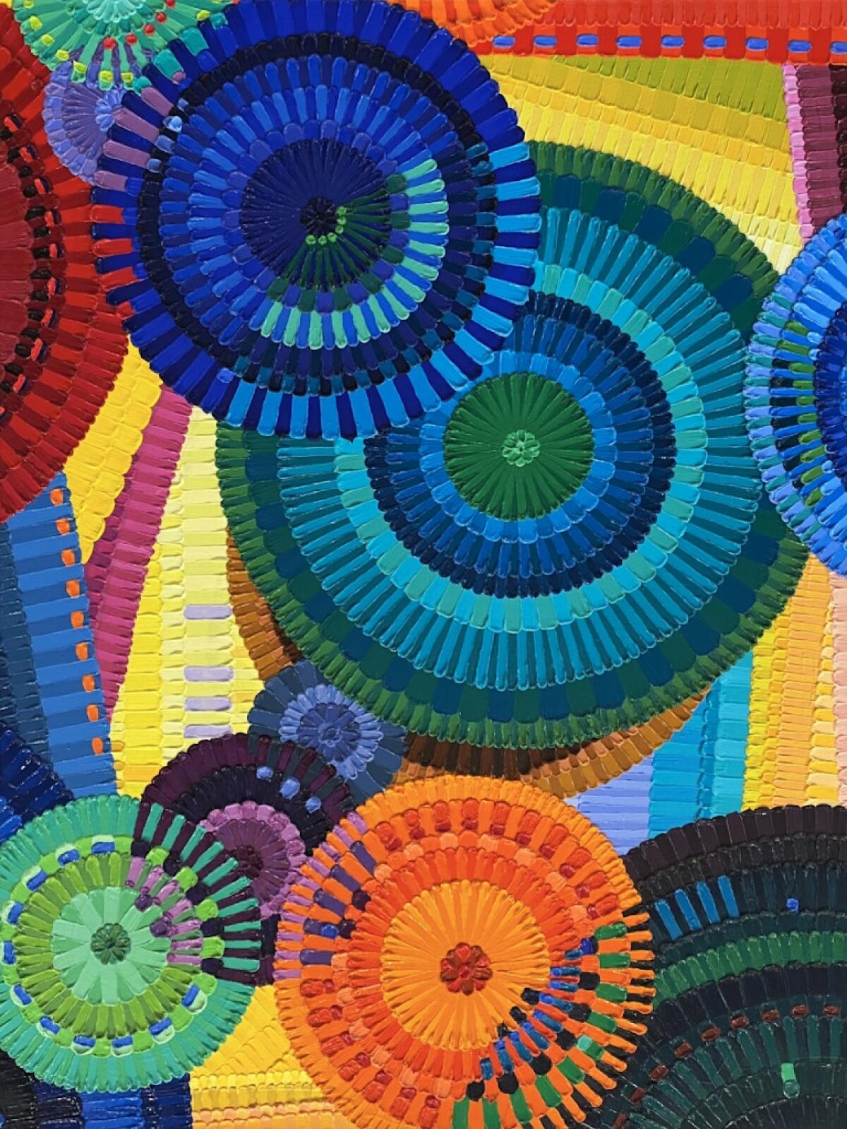 A colorful painting with overlapping circles by June Edmonds