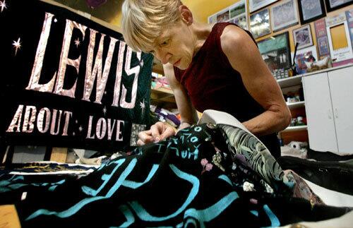 Gert McMullin, 50, sits inside her Atlanta workshop repairing the quilt. "I call them my boys," McMullin said. She also calls them, "my soldiers." Through the years she has seen it all: wedding rings, cremation ashes, letter jackets, a bowling ball, a Ziploc bag of marijuana, champagne glasses, an air-conditioning vent, feather boas, vibrators, dishonorable discharge papers, and even hypodermic needles.