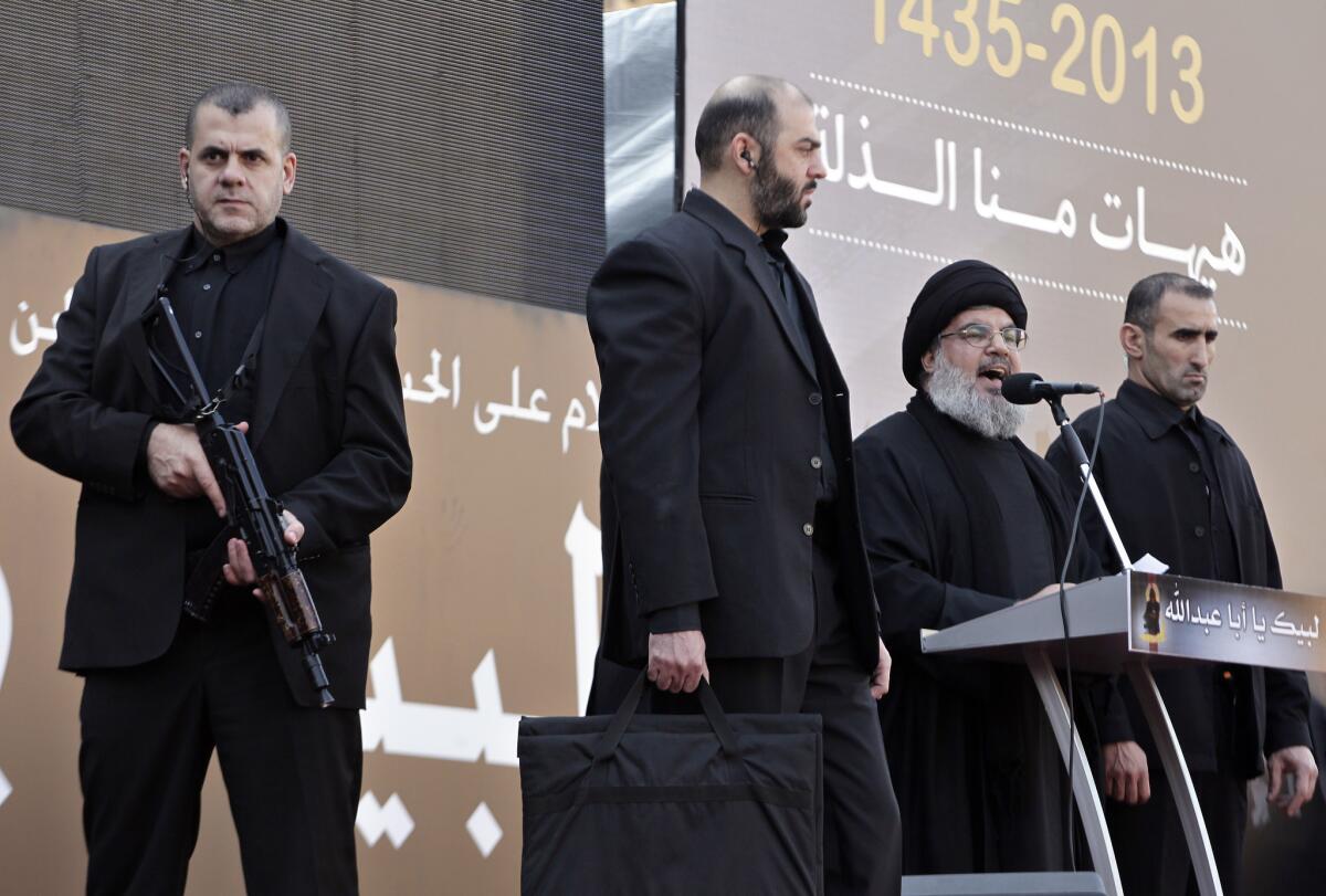 Hezbollah leader Hassan Nasrallah speaks to the crowd in a rare public appearance Thursday in Beirut.