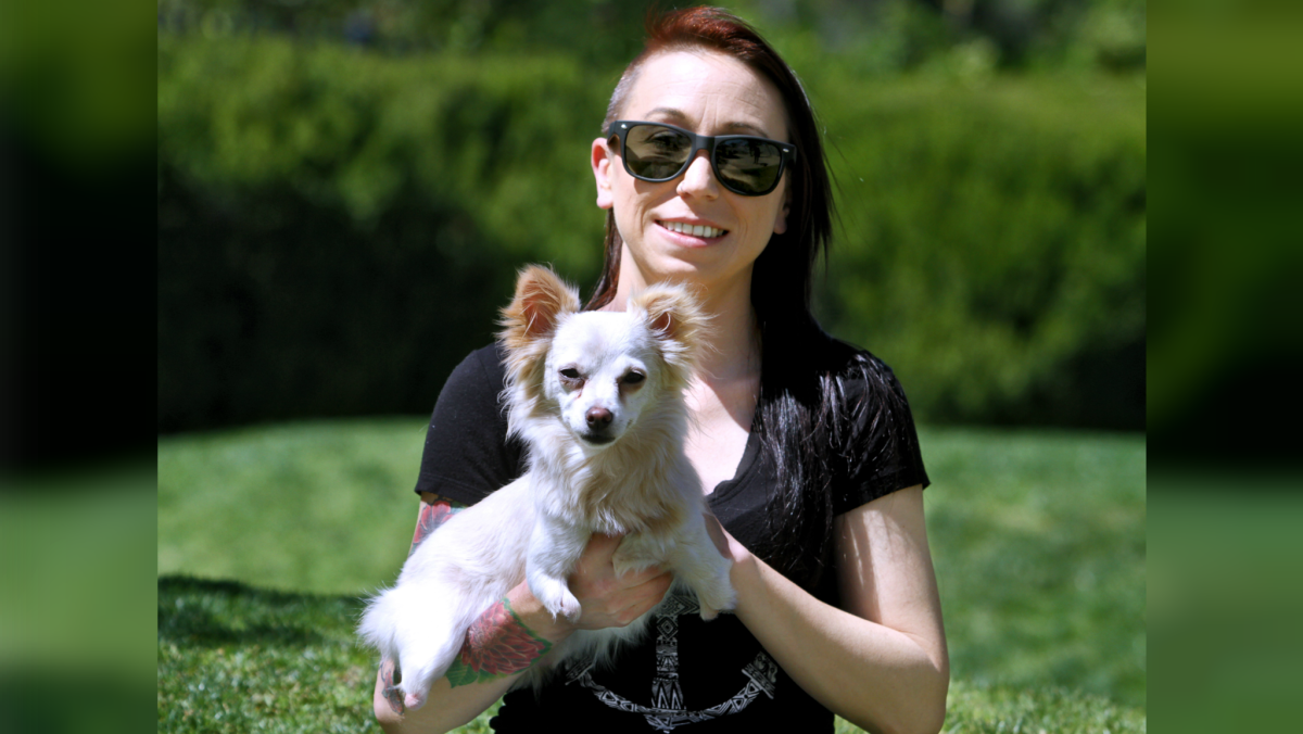 Christine Broyles, 30 of La Cañada Flintridge, holds Nimble, a 1-year old female Chihuahua mix born with disintegrating legs at Mayors' Discovery Park in La Cañada Flintridge on Friday, April 15, 2016. After seven surgeries, Nimble is set to get some new legs with the help of a 3-D printing company.