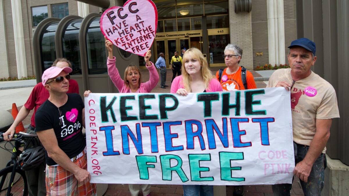 In this May 15, 2014 file photo, protesters hold a rally to support "net neutrality."