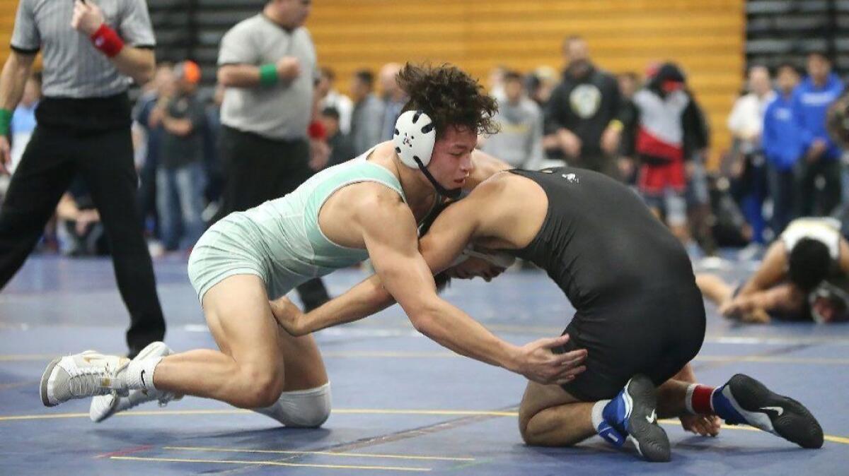 Sophomore 160-pounder Max Wilner, left, seen in the Five Counties Tournament on Jan. 12, leads Fountain Valley High into the CIF Southern Section Dual Meet wrestling championships on Saturday.