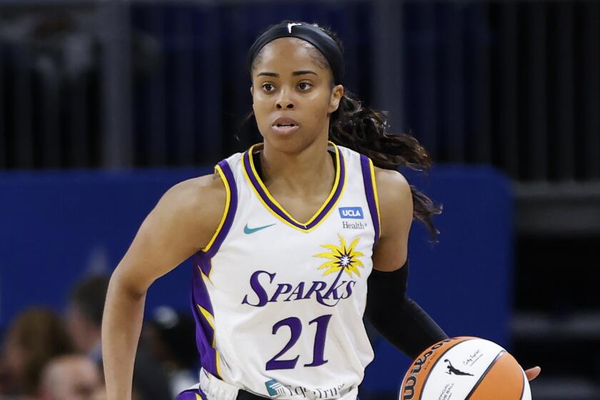 Los Angeles Sparks guard Jordin Canada brings the ball up court