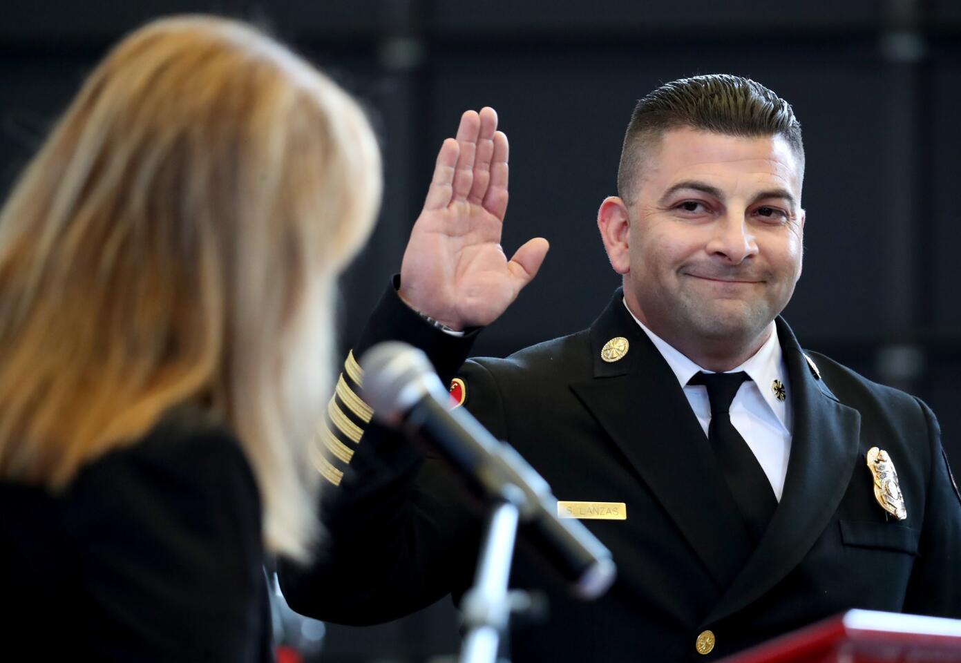 New Glendale fire chief Silvio Lanzas was sworn in by Glendale city manager Yasmin Beers during formal swearing in ceremony at Station 21 in Glendale on Thursday, Feb. 21, 2019.