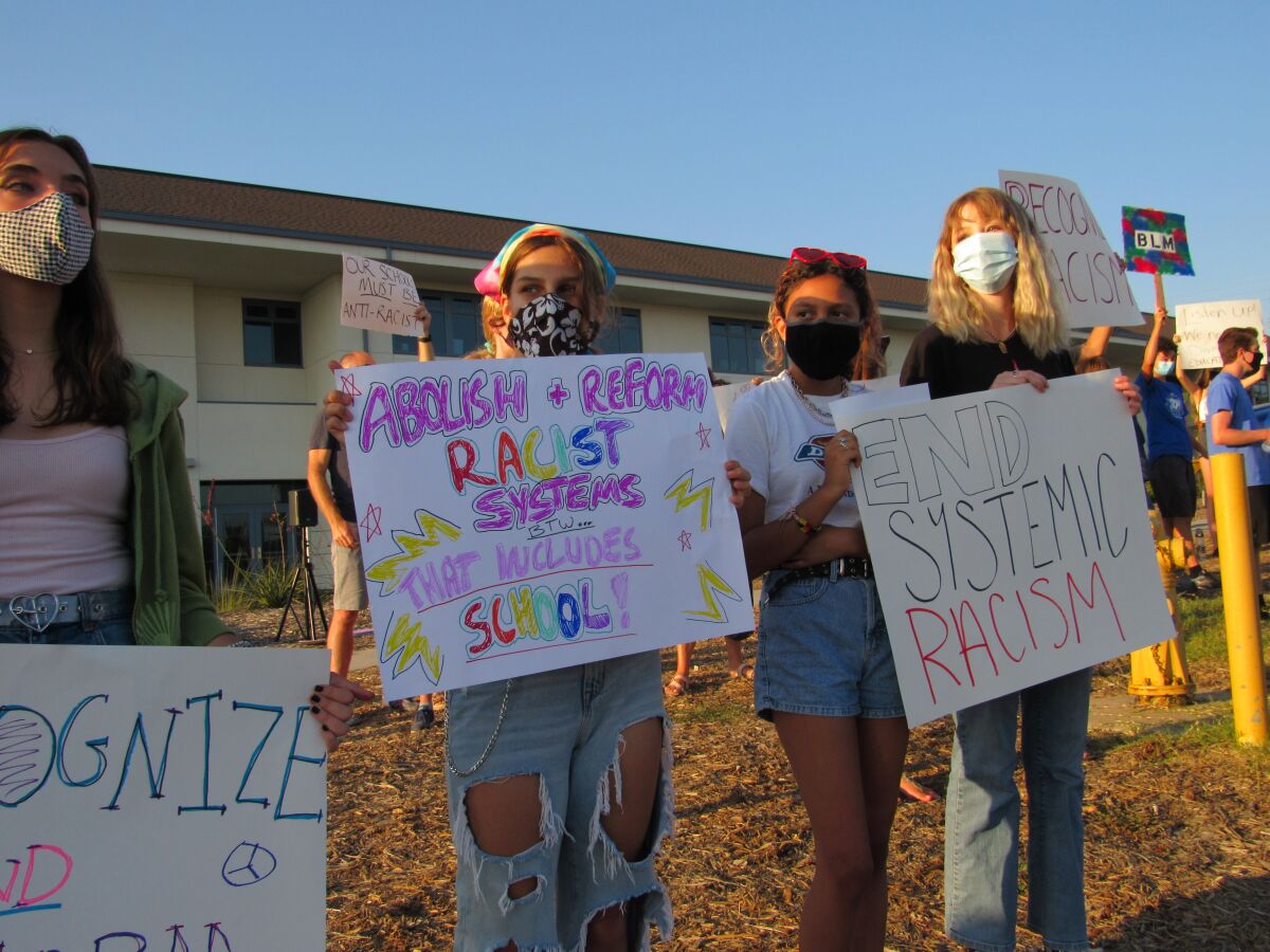 Students protest in front of San Dieguito High School Academy.