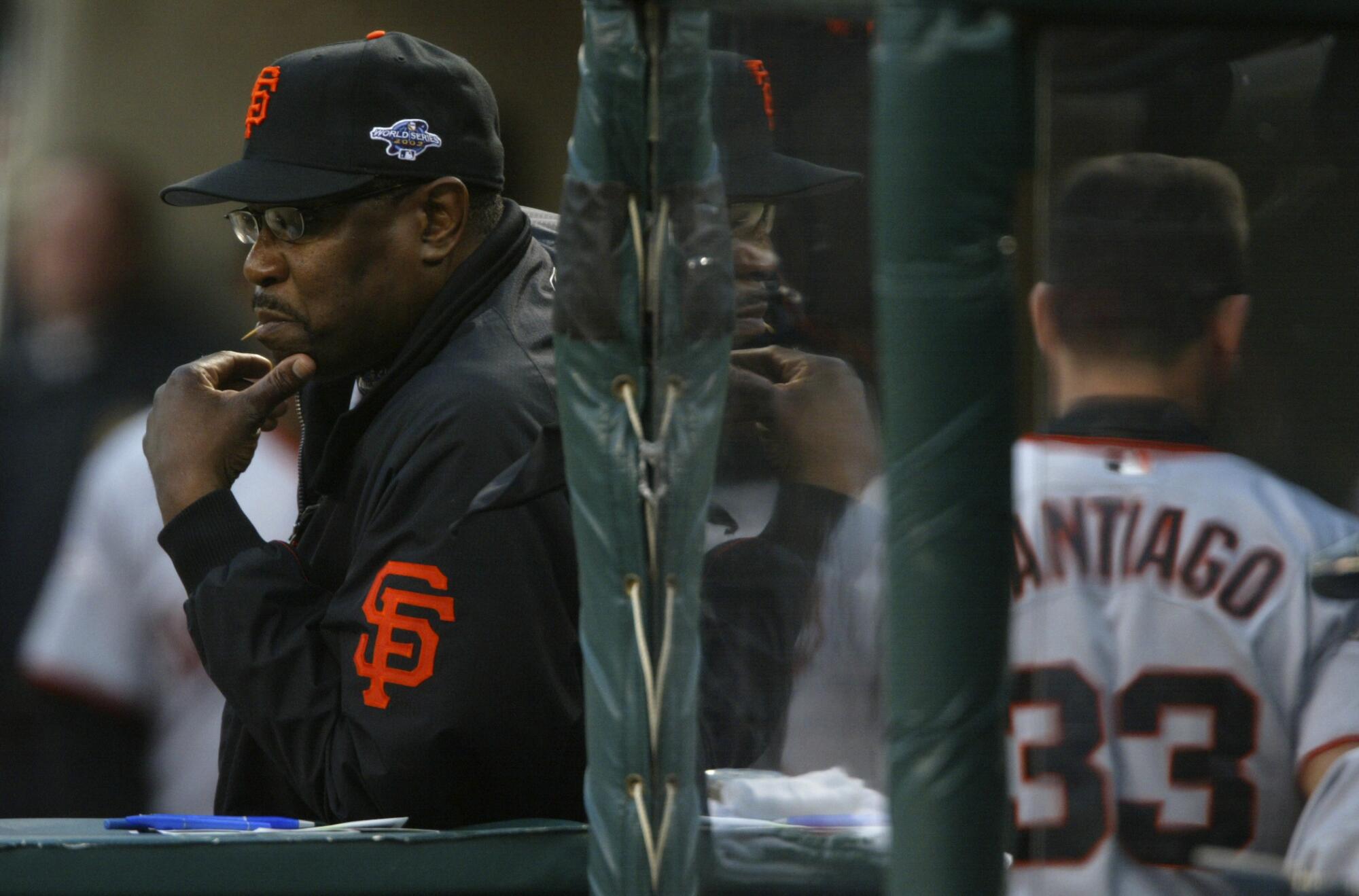 Giants manager Dusty Baker watches from the dugout during Game 6 of the 2002 World Series against the Angels.