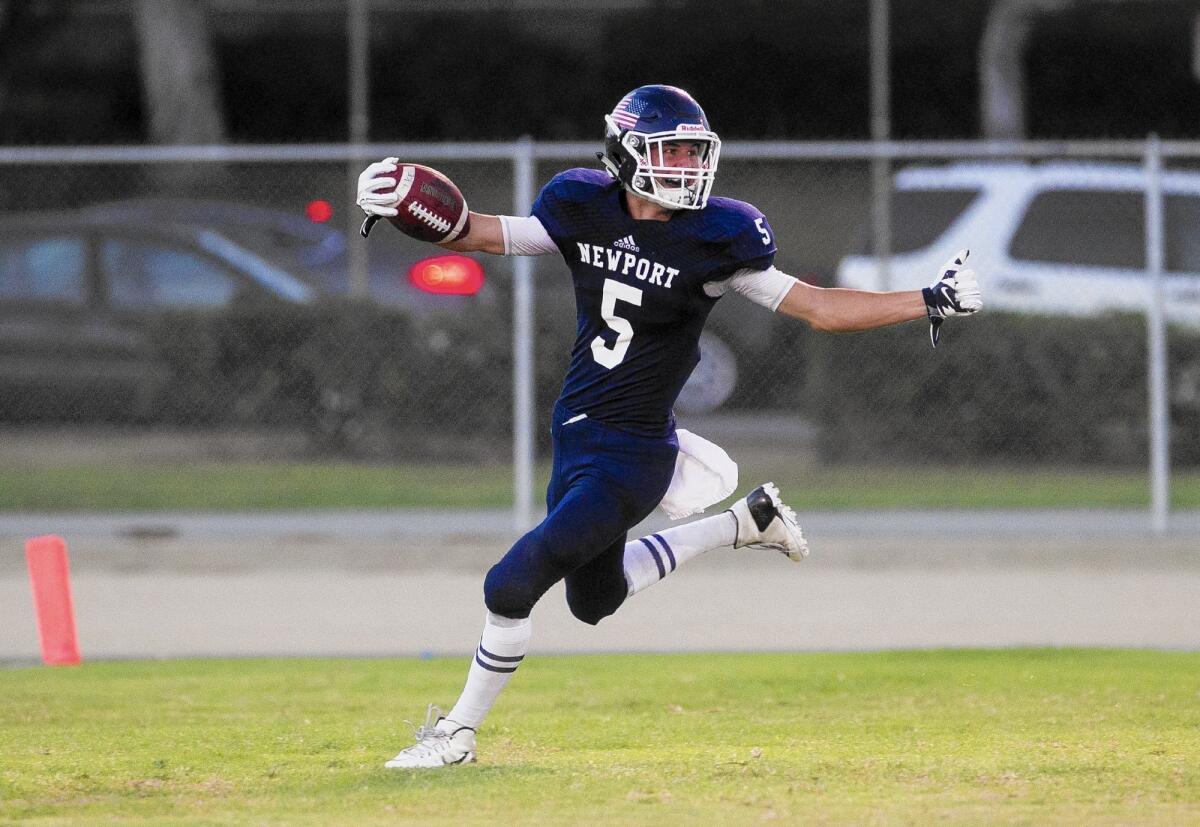 Newport Harbor High's Jack Rapillo celebrates after scoring a touchdown on a punt return in the first half against Eisenhower at Davidson Field on Thursday.
