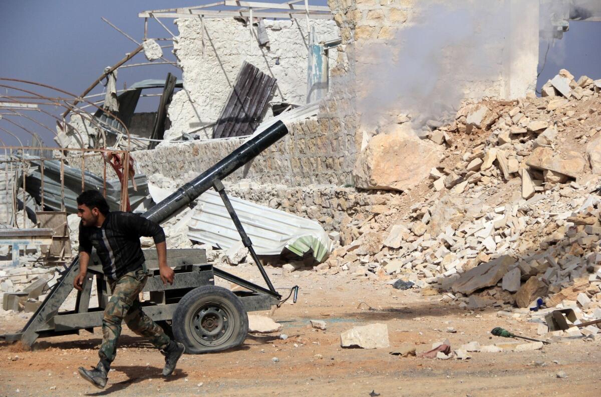 A rebel fighter runs for cover as a mortar is launched toward pro-government fighters on the outskirts of the northern Syrian city of Aleppo. Such mortar attacks are common in Damascus, the capital.