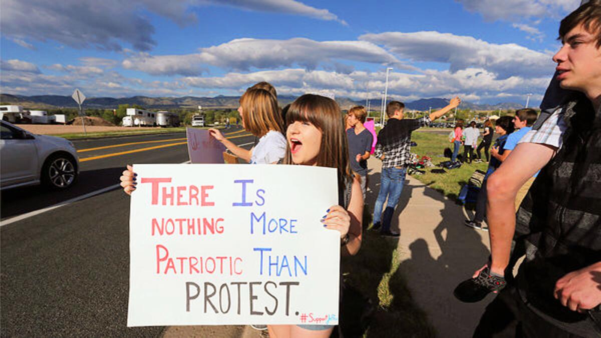 Students from schools in the Denver suburbs are protesting a proposal by the Jefferson County school board to emphasize patriotism and downplay civil unrest in the teaching of U.S. history.