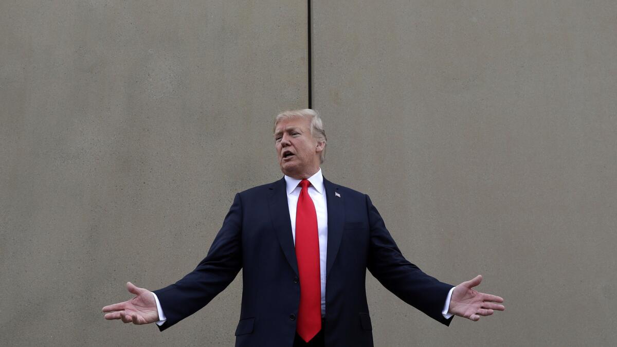 President Trump reviews border wall prototypes in San Diego in March.