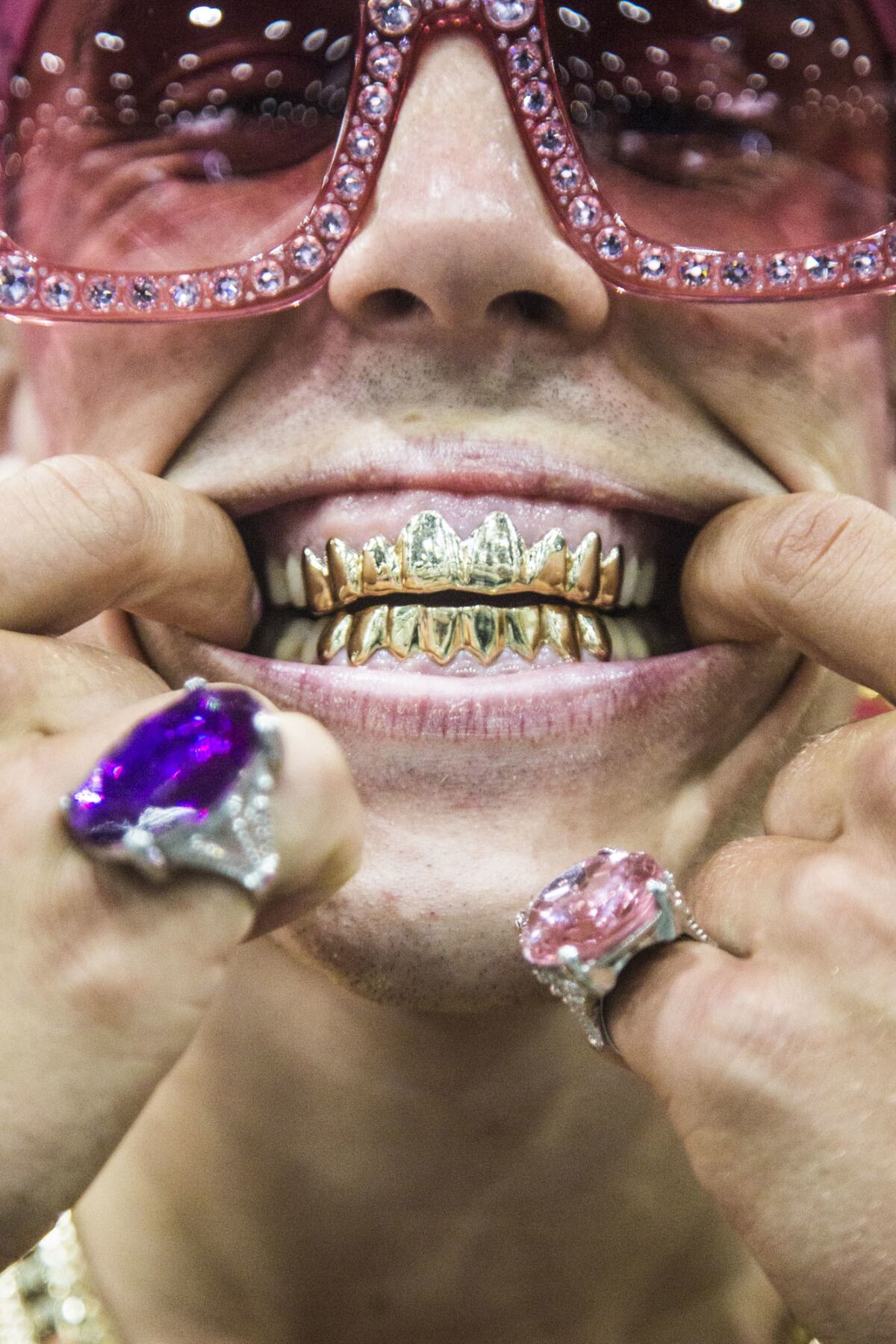 Candy Ken shows off his grills during RuPaul's DragCon LA.