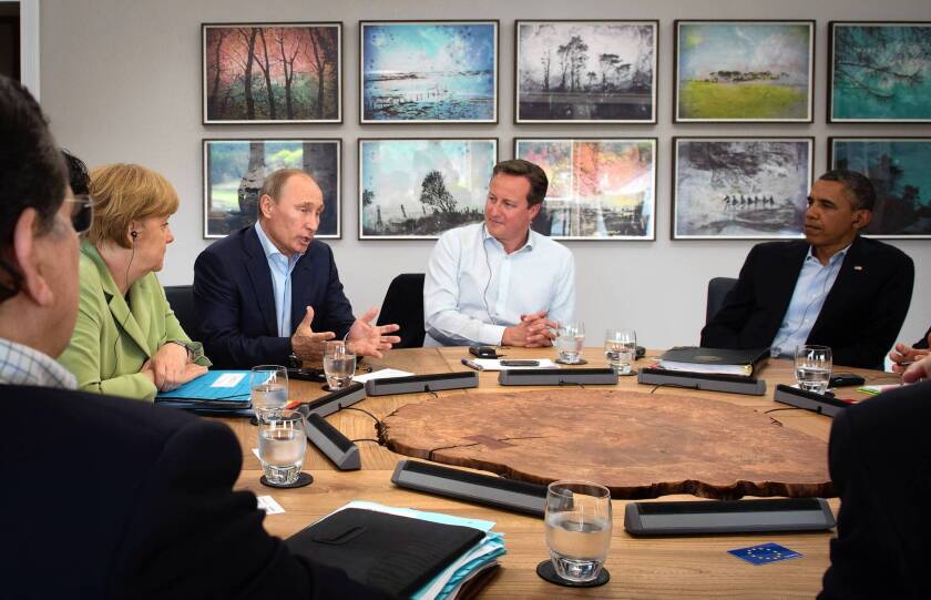 Russian President Vladimir Putin, center left, addresses other Group of 8 leaders, including British Prime Minister David Cameron, center, and President Obama, at the Group of 8 summit at Lough Erne in Enniskillen, Northern Ireland.