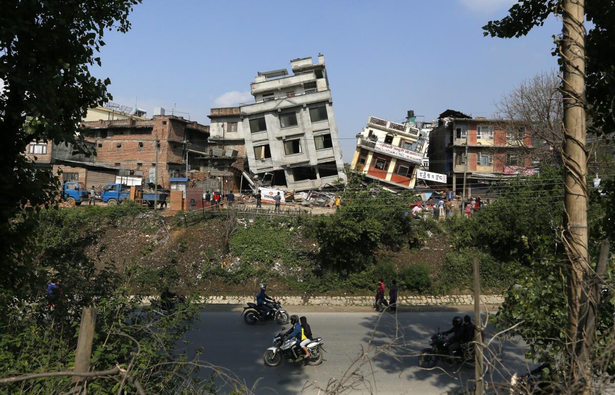 Damaged buildings teeter to their sides in Katmandu, Nepal, after a 7.8 earthquake.