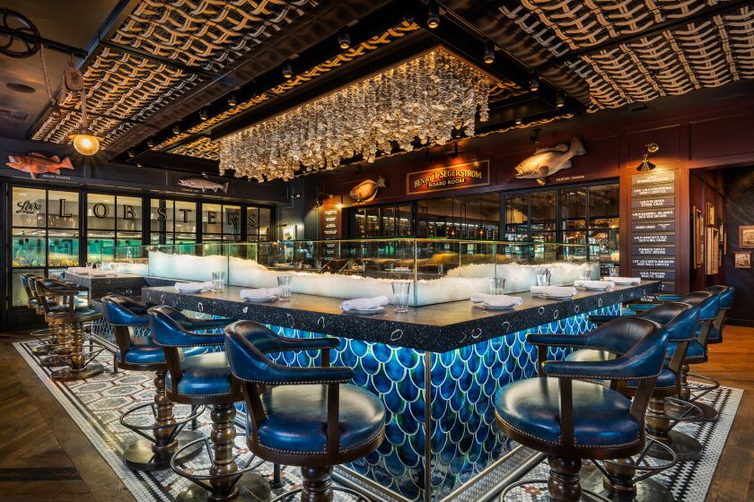 The Water Grill in Costa Mesa was designed by Hatch Design Group. Inspired by a refurbished ship, the seafood restaurant contains various nautical-themed components, woods and iron finishes.