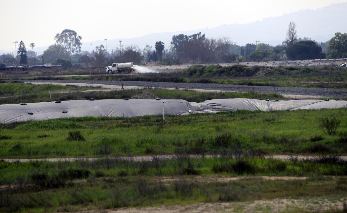 CARSON, CA - FEBRUARY 20, 2015: A water truck puts down water on the dirt road on the proposed site of the new NFL Stadium in Carson, CA. (Francine Orr/ Los Angeles Times)