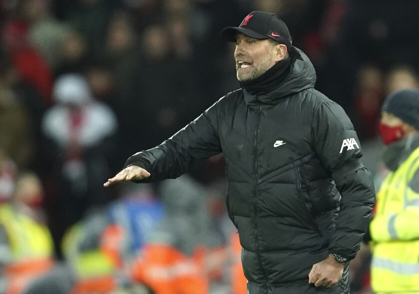 Liverpool's manager Jurgen Klopp reacts during the English Premier League soccer match between Liverpool and Aston Villa at Anfield stadium in Liverpool, Saturday, Dec. 11, 2021. (AP Photo/Jon Super)