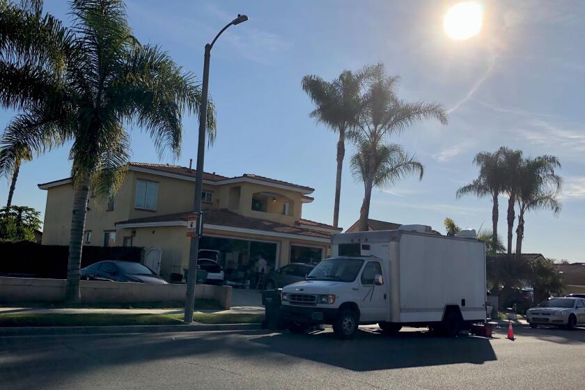 Hoang Xuan Le, 38, of Fountain Valley was arrested at his home Thursday in connection with a federal murder investigation, authorities said.