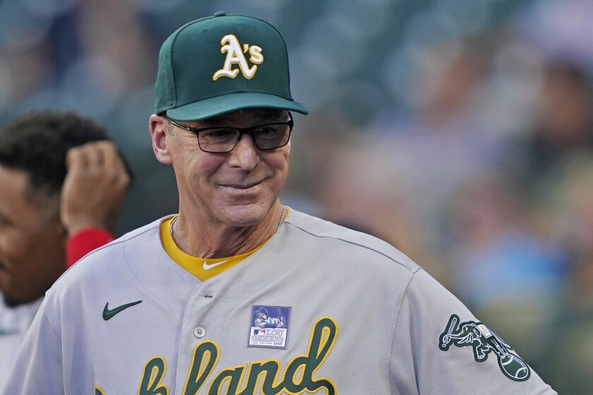 Oakland Athletics manager Bob Melvin stands in the dugout during the third inning of the team's baseball game against the Seattle Mariners, Wednesday, June 2, 2021, in Seattle. (AP Photo/Ted S. Warren)