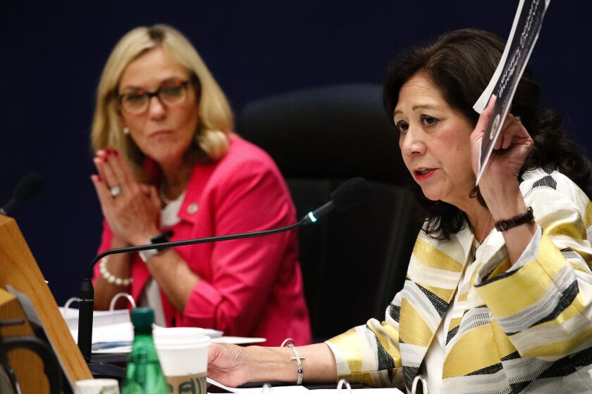 LOS ANGELES, CA - OCTOBER 01, 2019 Los Angeles County Supervisors Hilda Solis, right, and Kathryn Barger, left, during a Board meeting with Los Angeles County Sheriff Alex Villanueva to proposals regarding spending at the Sheriff’d Department in an effort to recover a $63 million budget deficit. (Al Seib / Los Angeles Times)