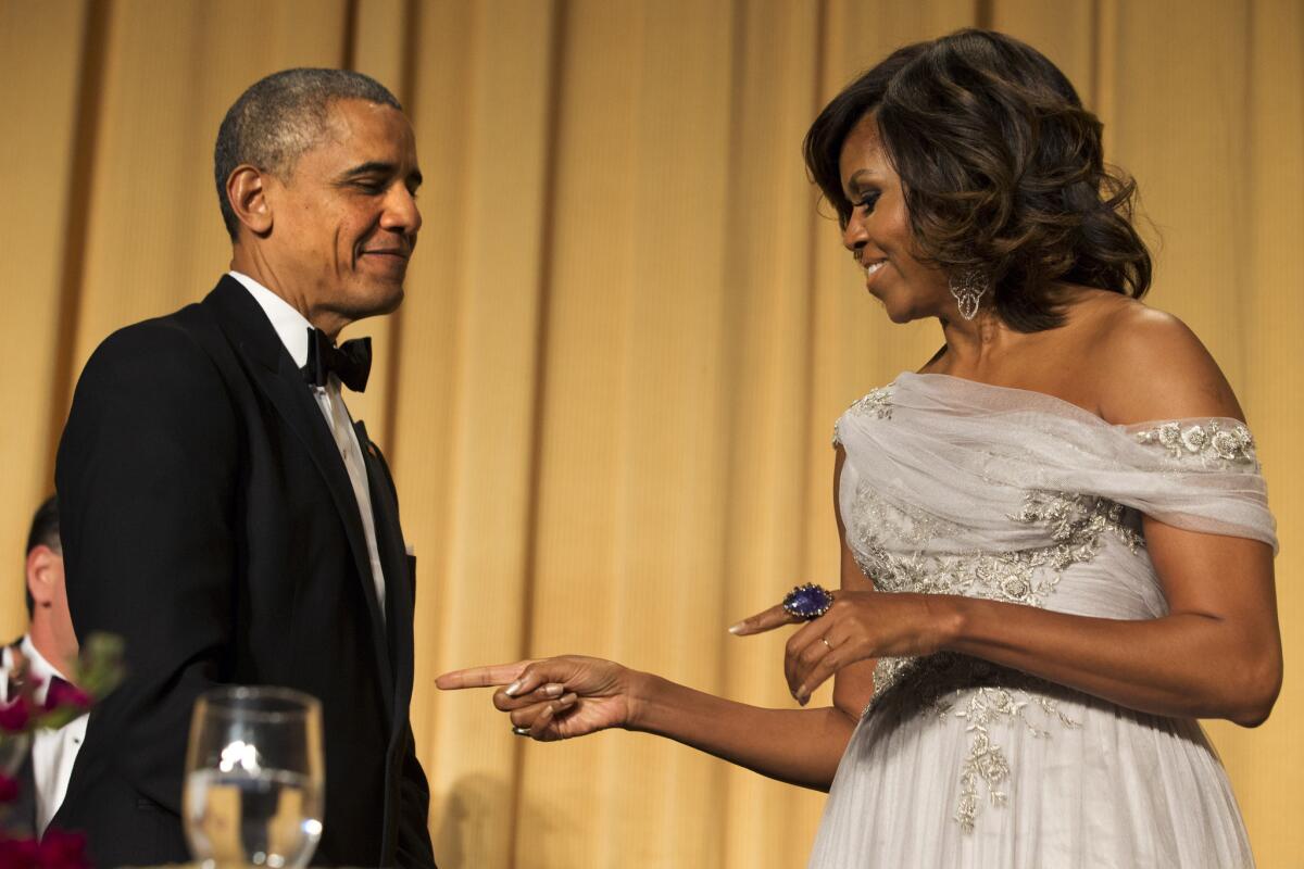 First Lady Michelle Obama jokes with President Obama during the White House Correspondents' Assn. Dinner at the Washington Hilton Hotel on Saturday.