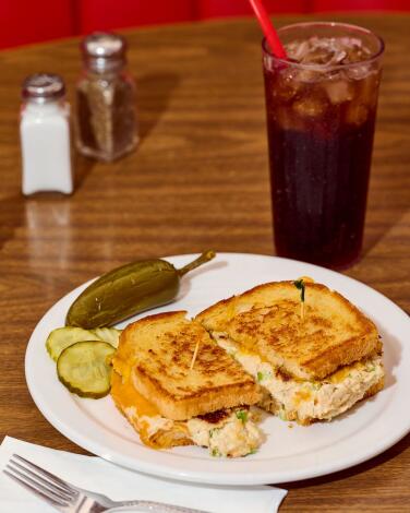 The tuna melt at Pann's Restaurant with pickle chips, jalapeno and a soda