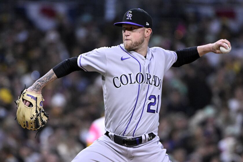 Colorado Rockies starting pitcher Kyle Freeland throws to a San Diego Padres batter during the second inning of a baseball game in San Diego, Friday, March 31, 2023. (AP Photo/Alex Gallardo)