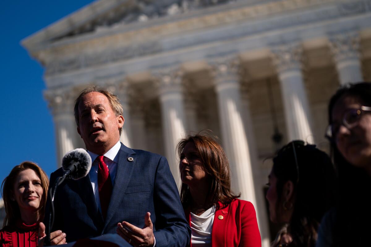 Texas Atty. Gen. Ken Paxton speaks outside the Supreme Court on Nov. 1, 2021.