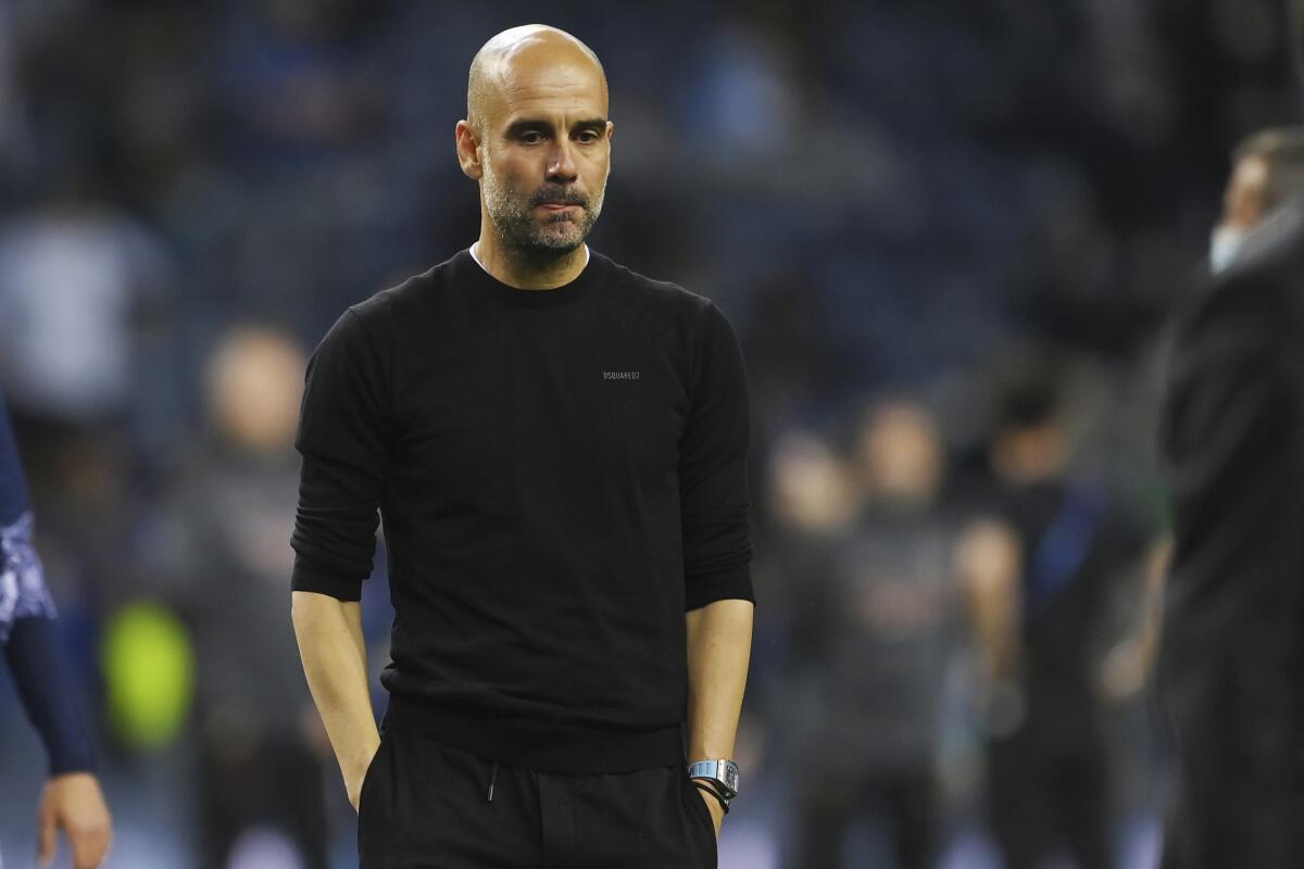 Manchester City coach Pep Guardiola reacts after the Champions League final May 29, 2021.