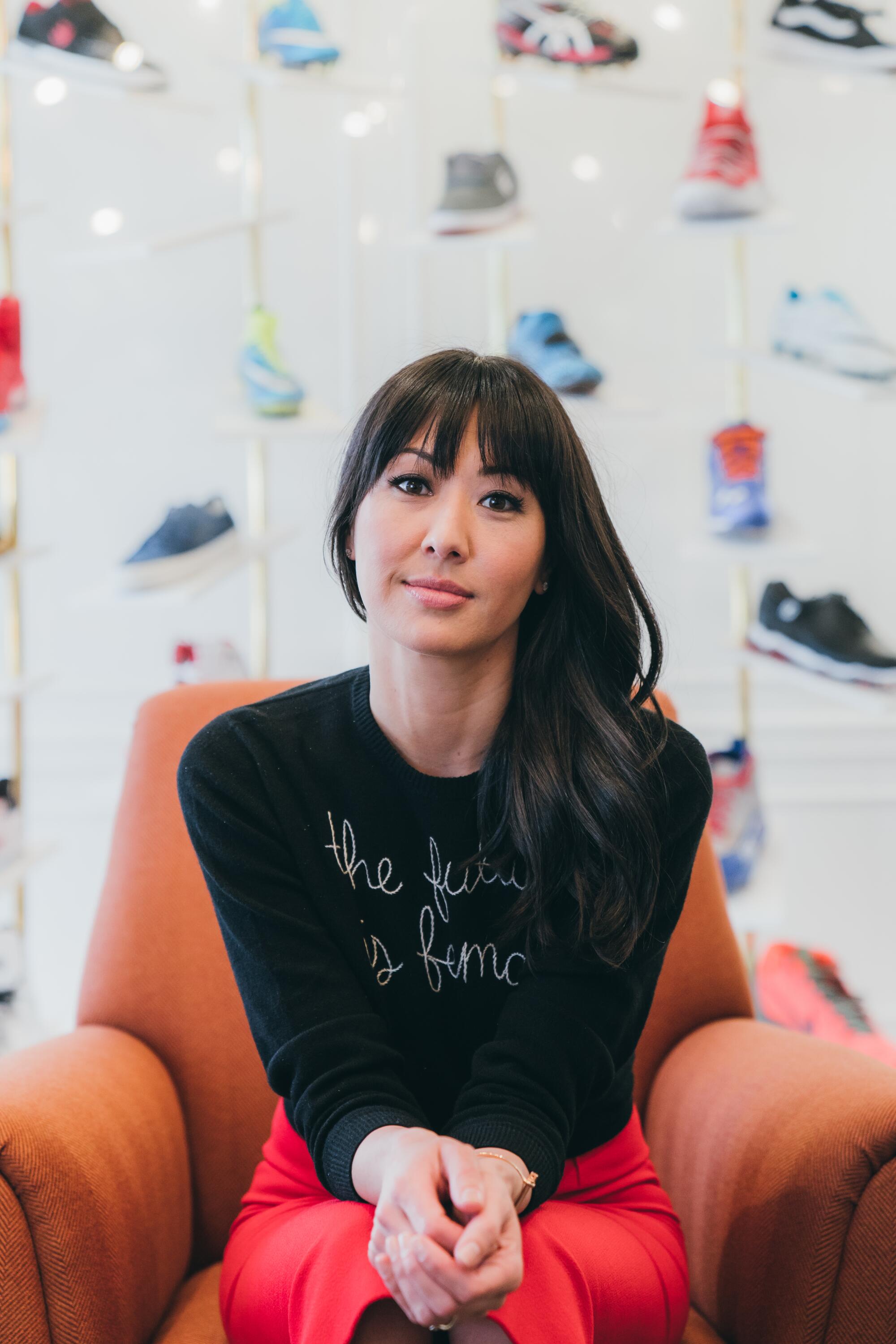 Lindsay Kagawa Colas, WNBA star Brittney Griner's agent, sits for a portrait in an office.