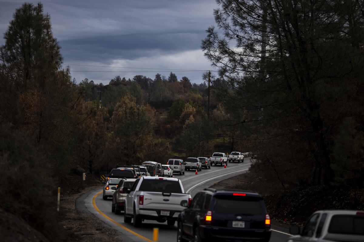 Vehicles sit in a queue along Skyway, waiting to gain access to Paradise.