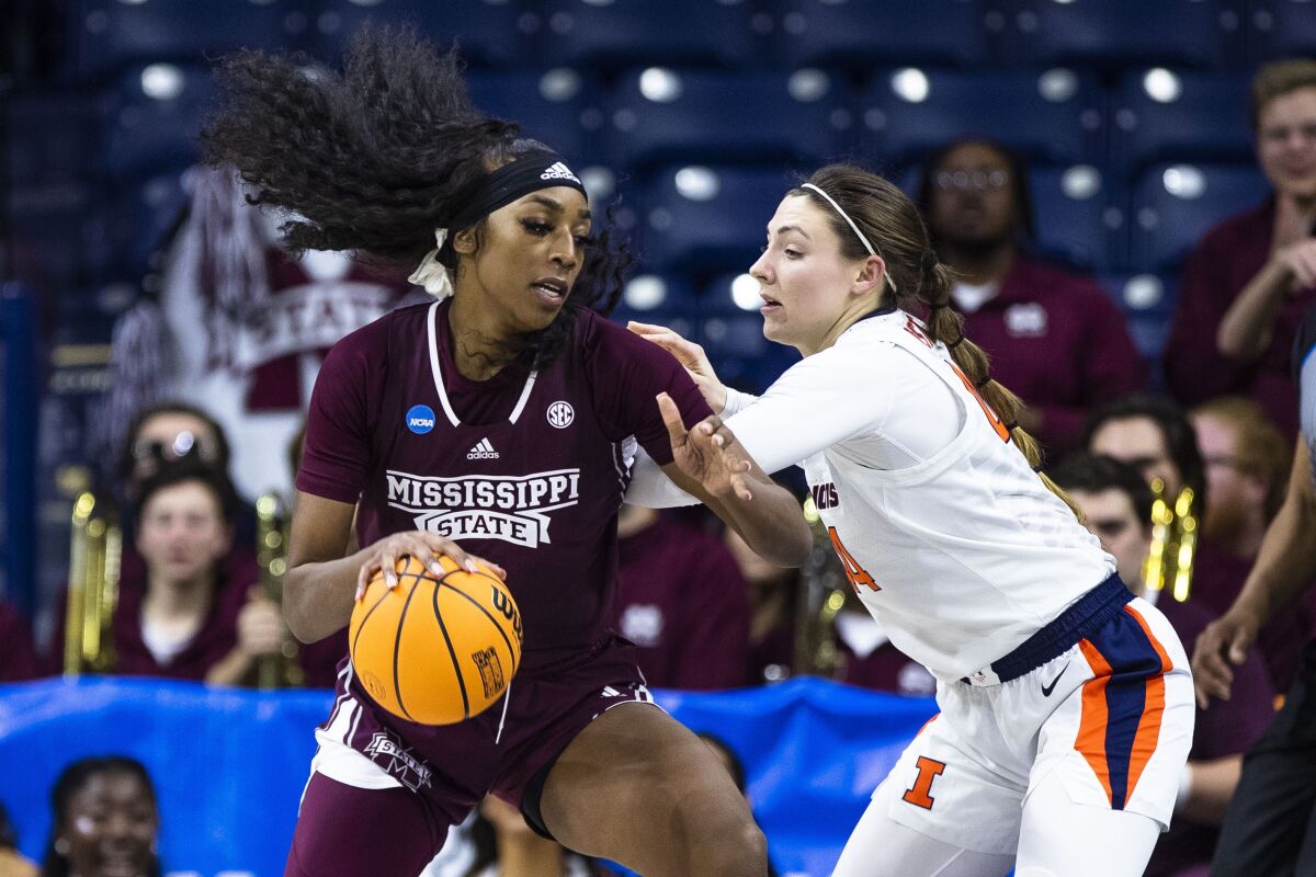 Mississippi State's Jessika Carter works against Illinois' Kendall Bostic.