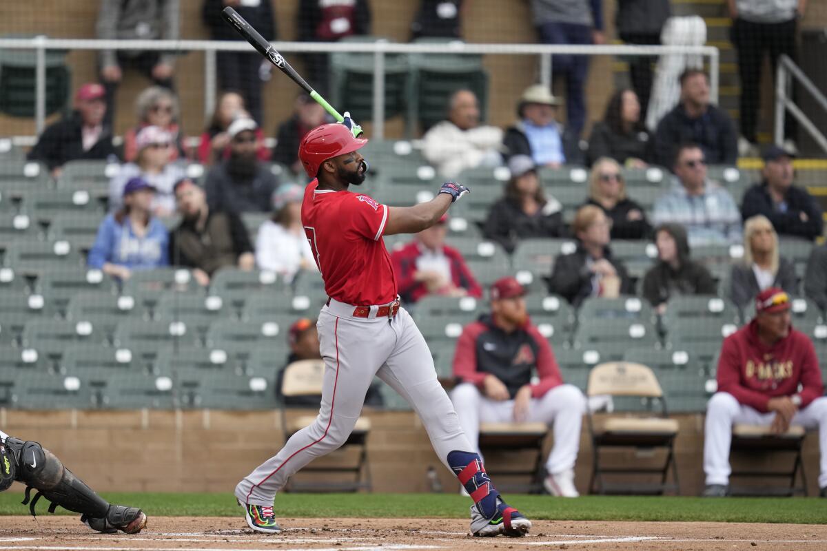 Angels' Jo Adell hits a home run during the first inning of a spring training game against the Arizona Diamondbacks.