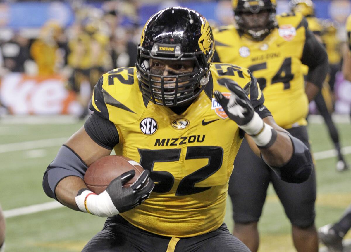 Missouri defensive lineman Michael Sam (52) warms up before the Cotton Bowl NCAA college football game against Oklahoma State in Arlington, Texas.