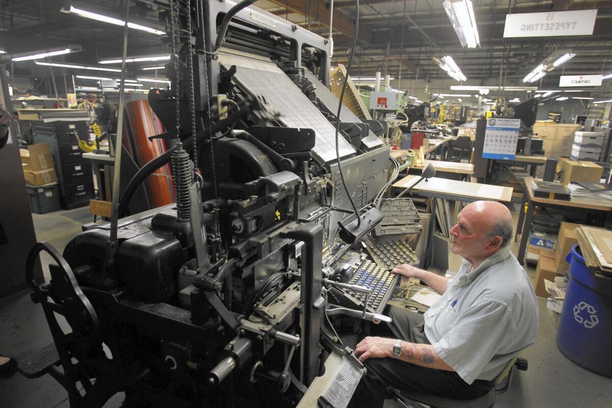 Rick Kavin creates lead type on an old Intertype machine at Kater-Crafts, the bookbinding company he runs with two siblings.