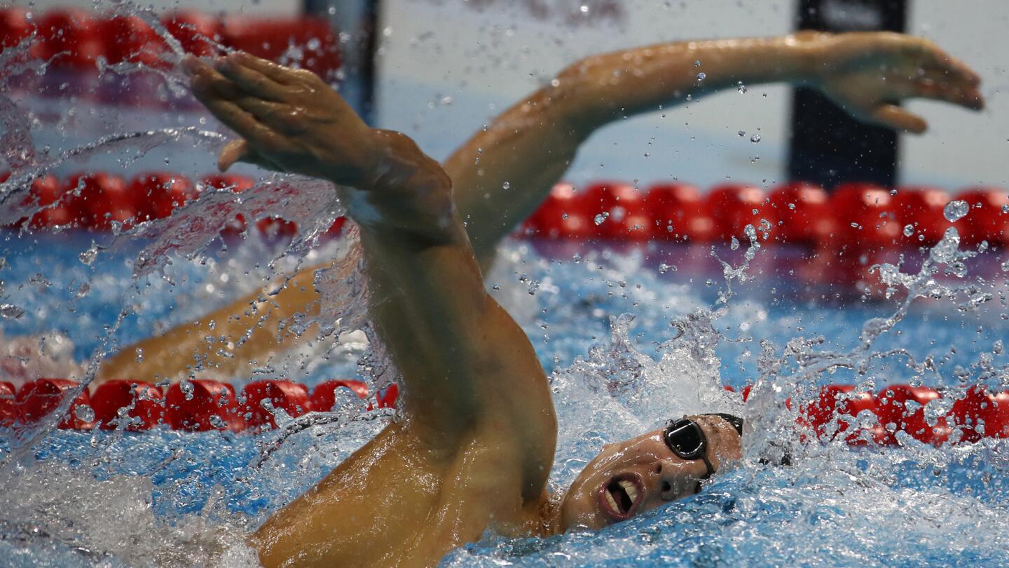 U.S. swimmer Chase Kalisz finishes second to Japan's Kosuke Hagino, left, in the 400-meter individual medley.