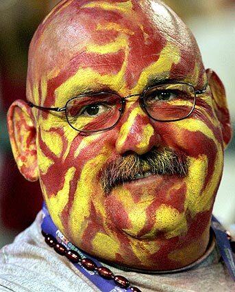 A USC fan smiles after USC defeated Oklahoma in the National Championship at the Orange Bowl in Miami.