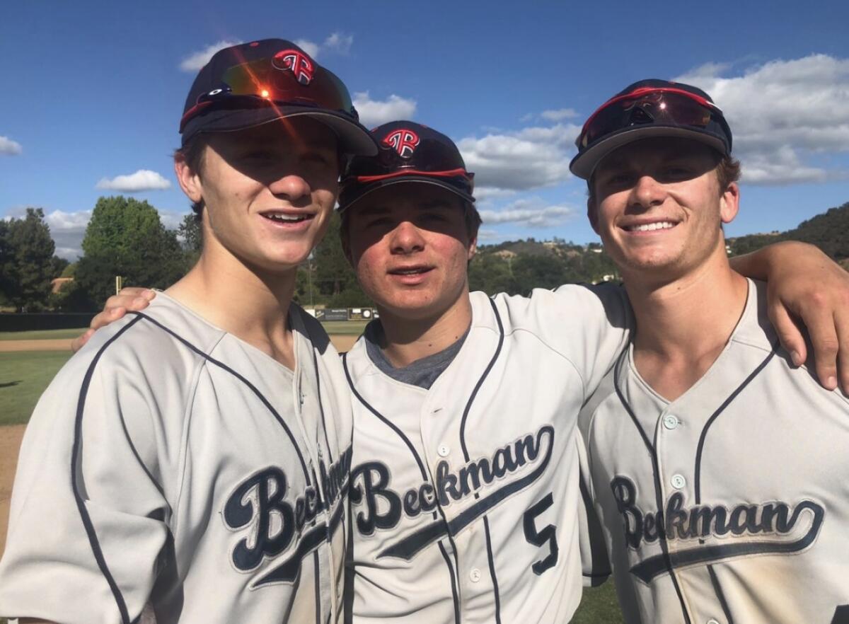 The McLain brothers Sean, left, Nick and Matt pose for a photo in 2018. 