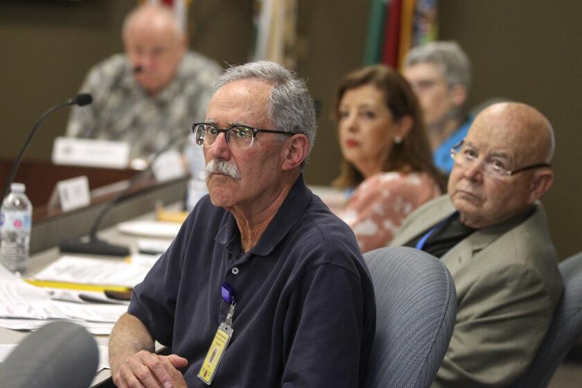 Members of the County of San Diego Citizen's Law Enforcement Review Board, including Gary Brown, front, Gary Wilson, right, and Lourdes Silva, center, listen as John Fattahi, an attorney representing the family of Kristopher Birtcher, who died while in custody in October 2017, speaks during a board meeting at the San Diego County Administration Center on Tuesday, June 11, 2019 in San Diego, California.