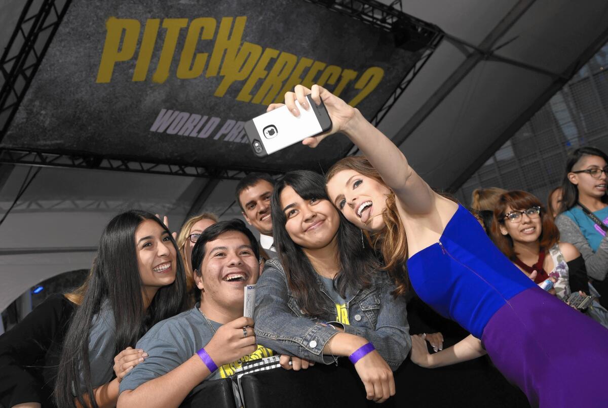 Actress Anna Kendrick takes a selfie with fans at the world premiere of "Pitch Perfect 2" at the Nokia Theatre last week.