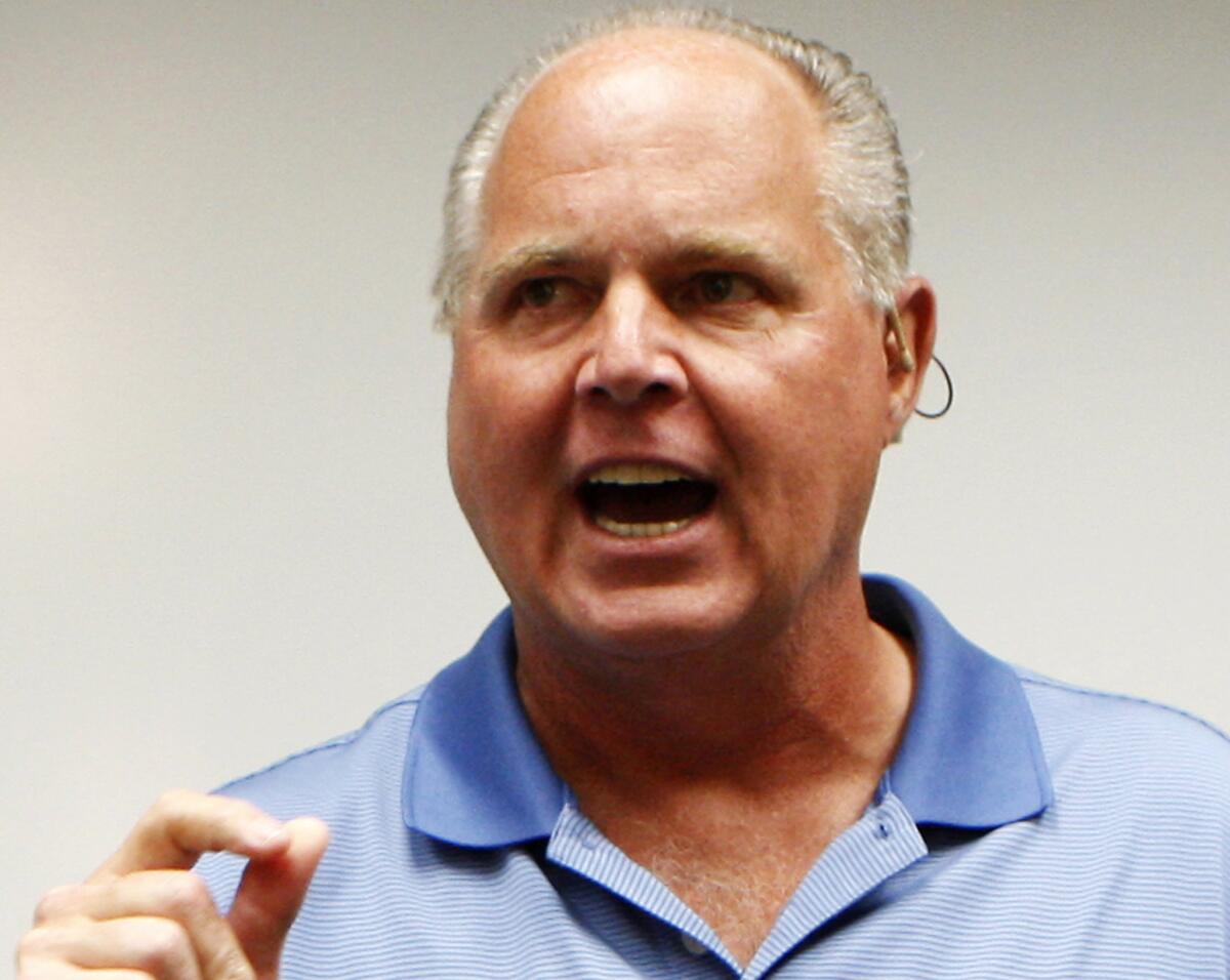 Conservative talk show host Rush Limbaugh speaks during a news conference in Honolulu.