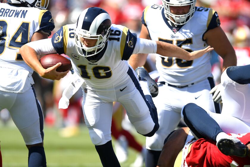 LOS ANGELES, CA - OCTOBER 13: Quarterback Jared Goff #16 of the Los Angeles Rams is forced out of the pocket in the second half against the San Francisco 49ers at Los Angeles Memorial Coliseum on October 13, 2019 in Los Angeles, California. (Photo by Jayne Kamin-Oncea/Getty Images)